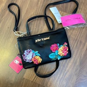 Betsey Johnson black crossbody/wristlet  with portable phone charger